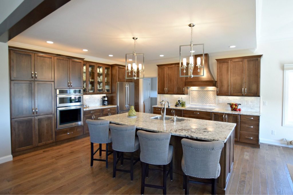 Transitional kitchen space with cherry cabinets