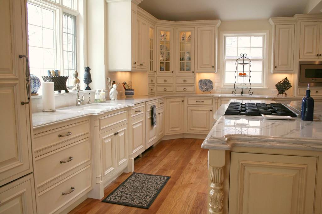 Traditional kitchen with light yellow painted custom cabinets