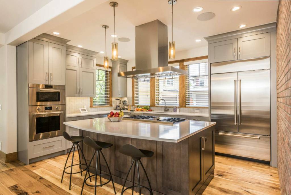 Urban loft kitchen with exposed brick wall