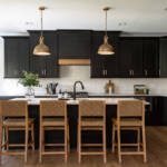 Black kitchen cabinets with natural wood accents