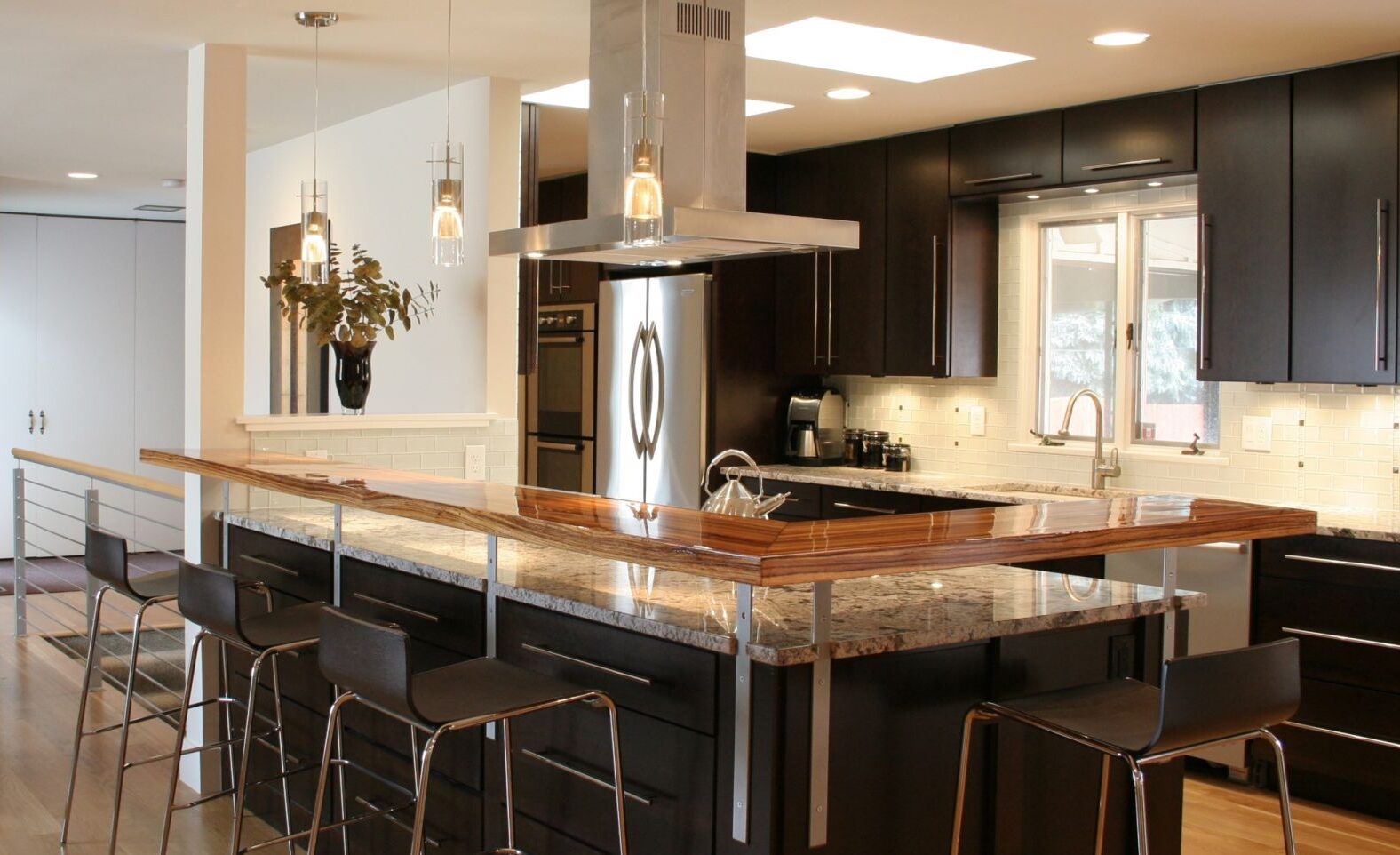 contemporary kitchen with espresso slab cabinets