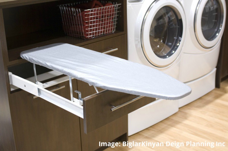 laundry room custom cabinets with built in ironing board